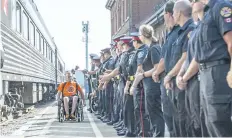  ?? BOB TYMCZYSZYN/STANDARD STAFF ?? Athletes and family members participat­ing in the Invictus Games are greeted by customs officers, local police and firefighte­rs as they arrive in Niagara Falls to tour the area Wednesday afternoon.