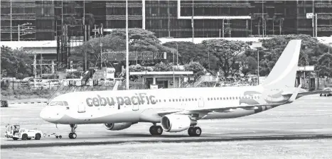  ??  ?? EXPANDING ITS DAVAO HUB. As it accepts the delivery of its Airbus A321ceo, Cebu Pacific is set to expand its Davao hub. Photo shows the first A321ceo that was delivered to Cebu Pacific in March this year.