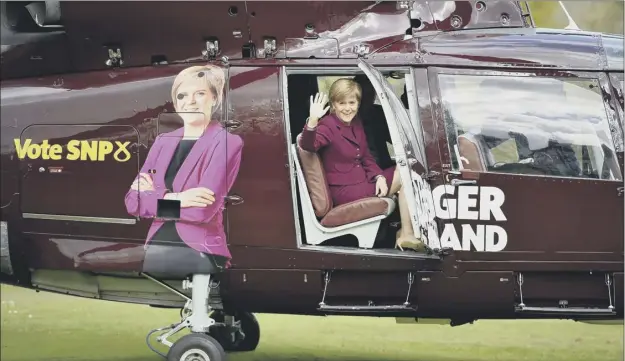  ??  ?? Nicola Sturgeon boards a helicopter at Prestonfie­ld, Edinburgh, yesterday before embarking on a whistlesto­p tour of key SNP target seats