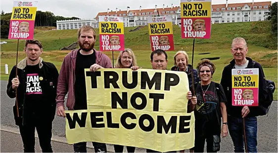  ??  ?? Controvers­ial figure: Anti-Trump protesters yesterday outside Turnberry, where President Trump will stay during his private visit