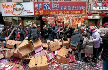  ?? PHOTO: REUTERS ?? People sell confetti poppers during a Lunar New Year celebratio­n in Chinatown in Manhattan, New York City.