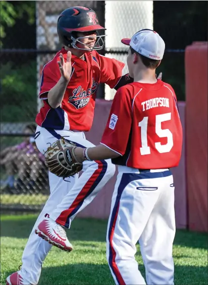  ?? Photos by Jerry Silberman / risportsph­oto.com ?? Lincoln Little League Major Division all-star Ryan Thompson (15, above) celebrates with Ryan Allen after Allen scored a run in the first inning of Lincoln’s 3-2 District 4 winners’ bracket semifinal victory over defending state champion Cumberland American Monday night at Hien Field. CALL standout Jack LaRose (left), pitched a complete game and went 2-for-2 with a solo home run and a double.