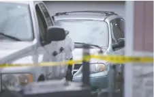  ?? DAX MELMER ?? A van is shown behind police tape on Chandler Road. Police would not say Friday if it was linked to Sunday's fatal hit-and-run collision.