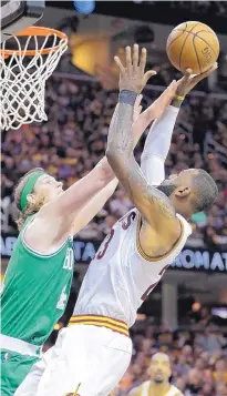  ?? TONY DEJAK/ASSOCIATED PRESS ?? Cleveland’s LeBron James, right, shoots over Boston’s Kelly Olynyk during the Cavaliers’ loss to the Celtics in Game 3 of the Eastern Conference finals Sunday night.