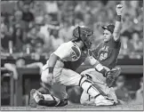  ?? MICHAEL PEREZ/AP PHOTO ?? Jeff McNeil of the Mets (68) scores a run ahead of a throw to Phillies catcher Jorge Alfaro in the eighth inning of Friday’s game at Philadelph­ia.