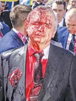  ?? Picture: AFP ?? ATTACKED. Russian ambassador to Poland Sergei Andreev after being covered with a red substance during a protest prior to a ceremony at the Soviet soldier war mausoleum in Warsaw, Poland, yesterday.