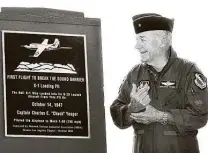  ??  ?? Yeager receives a plaque from the National Defense Industrial Associatio­n in October 2002.