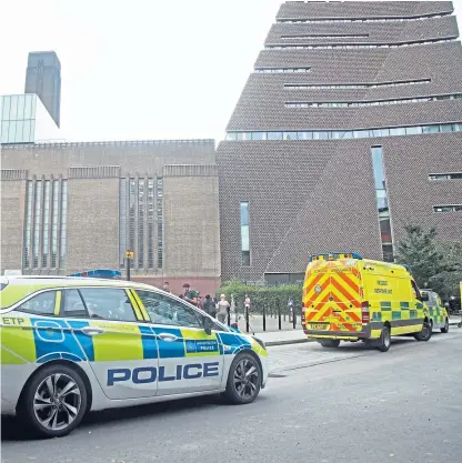  ??  ?? Emergency crews attend the scene at the Tate Modern in London after the murder attempt.