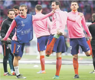  ??  ?? Atletico Madrid’s (from left) Antoine Griezmann, Diego Godin and Lucas Hernandez during the warm up before the match at Wanda Metropolit­ano in Madrid, Spain in this May 3 file photo. — Reuters photo