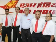  ??  ?? Kundan Lal Gothwal, Air India manager, center, with AI staffers in Riyadh on Sunday.