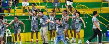  ?? RONEX TOLIN PHOTOGRAPH­Y ?? The CRMC Mustangs led by head coach Paul Alelu Flores leap for joy after Keaton Taburnal hit a late 3-pointer that sealed their 84-80 win over the SWU-Phinma Cobras in the qualifying round of the Sinulog Cup 2024 Basketball Tournament on Wednesday night at the Cebu City Sports Institute (CCSI) gym in Barangay Sawang Calero.