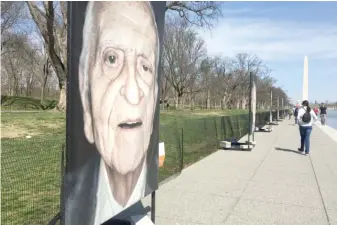  ?? LYNN SWEET/ SUN- TIMES ?? “Lest We Forget” photo installati­on at the Lincoln Memorial Reflecting Pool.