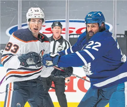  ?? CLAUS ANDERSEN GETTY IMAGES ?? Zach Bogosian, introducin­g himself to Edmonton’s Ryan Nugent-Hopkins, has added needed toughness to the Leafs’ blue line.