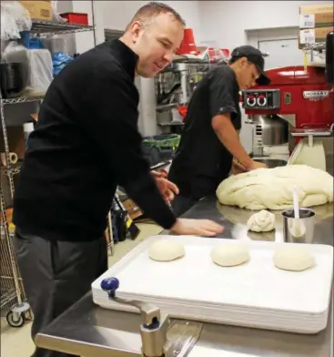  ?? TAWANA ROBERTS — THE NEWS-HERALD ?? Marco’s Pizza Owner Joe Jaros is hands-on at his newest location at 1444 Mentor Ave. in Painesvill­e Township on Jan. 8.