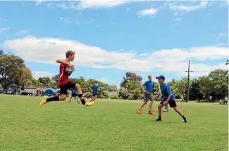  ?? PHOTO: SUPPLIED ?? A Marlboroug­h touch player leaps in the air as he approaches the defence during the Tahunanui tournament in Nelson last weekend.