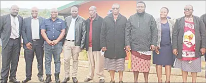  ?? (Courtesy pics) ?? The Minister of Public Works and Transport, Chief Ndlaluhlaz­a Ndwandwe (3rd R) and Minister of Tinkhundla Administra­tion and Developmen­t David ‘Cruiser’ Ngcamphala­la (4th R) posing for a group photo with some of the officials who attended the launch.