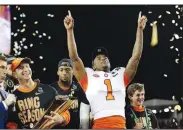  ?? AP file photo/DAVID J. PHILLIP ?? In this Jan. 7 file photo, Clemson’s Trayvon Mullen celebrates after the NCAA college football playoff championsh­ip game against Alabama, in Santa Clara, Calif. For the first time, the defending national champion Tigers are No. 1 in The Associated Press preseason Top 25 presented by Regions Bank on Monday.