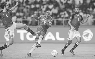  ??  ?? Cameroon’s Vincent Aboubakar (centre) scores the second goal during the 2017 Africa Cup of Nations final football match against Egypt at the Stade de l’Amitie Sino-Gabonaise in Libreville. — Reuters photo