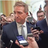  ??  ?? Sen. Jeff Flake, R- Ariz., pauses while he is questioned about Supreme Court nominee Brett Kavanaugh on Capitol Hill last week.
