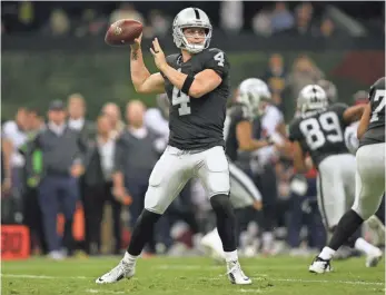  ?? ERICH SCHLEGEL, USA TODAY SPORTS ?? “He is unflappabl­e,” Raiders coach Jack Del Rio says of quarterbac­k Derek Carr, above.