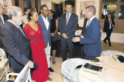  ?? (Photos: Joseph Wellington) ?? Sandals Resorts Internatio­nal Executive Chairman Adam Stewart (right) has the attention of Prime Minister Dr Ralph Gonsalves (left) and Prime Minister of Jamaica Andrew Holness (fourth from left), as well as Minister of Legal and Constituti­onal Affairs Marlene Malahoo Forte and Finance Minister Dr Nigel Clarke, on tour of the newly launched Sandals Dunn’s River.