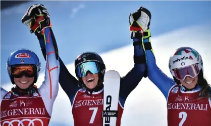 ?? Photograph: Jeff Pachoud/AFP/Getty Images ?? Second-placed Mikaela Shiffrin of the US, winner Sara Hector of Sweden and Italy's Marta Bassino celebrate in the finish area after the women's giant slalom event in Courchevel on Wednesday.