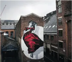  ?? CHRISTOPHE­R FURLONG / GETTY IMAGES FILES ?? Serenity — a recently painted mural in tribute to the suffragett­e movement and all women who stand defiant in the face of injustice on a wall in Manchester, England.