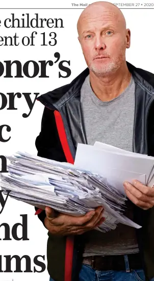  ??  ?? ANGER: Neil Gaskell with paperwork from his four-year legal battle