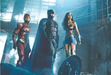  ?? WARNER BROS. PICTURES ?? Ezra Miller, Ben Affleck and Gal Gadot, from left, star in “Justice League,” out on Nov. 17.