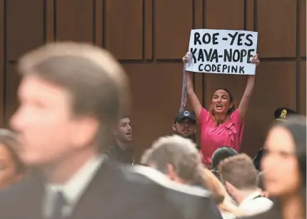  ??  ?? A protester disrupts the hearing for Supreme Court nominee Brett Kavanaugh on Sept. 4.