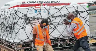  ?? | EPA ?? AIPORT staff unload Covid-19 vaccines that arrived in Luanda, Angola, last month. Plans are also moving forward to establish a subregiona­l body for the co-ordination of health issues for the Economic Community of Central African States, says the writer.