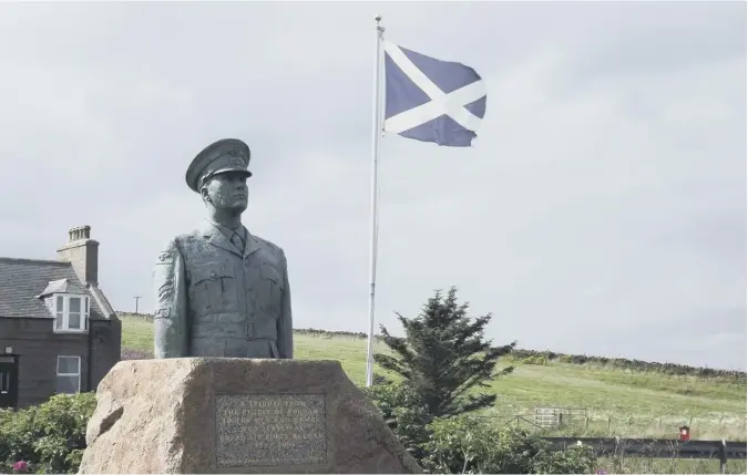  ??  ?? 0 Scotsman reader Dennis Forbes Grattan took this picture of the tribute statue to the men of RAF Buchan just outside Peterhead. The bronze statue of the upper body of a Royal Air Force airman in number one dress with peaked cap is mounted on a plinth of granite and commemorat­es RAF Buchan over its 52 years of service.