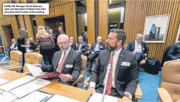  ??  ?? GAME ON: Manager Derek McInnes, right, and Aberdeen Football Club chief executive Ally Prockter at the meeting