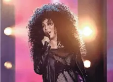  ?? ETHAN MILLER, GETTY IMAGES ?? Cher, who celebrated her 71st birthday Saturday, came to the 2017 Billboard Music Awards stage in a sheer bodysuit and an oversize curly wig to rock If I Could Turn Back Time.