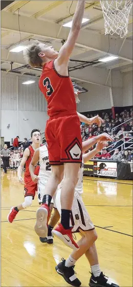  ??  ?? Senior Blackhawk Trey Anderson (No. 3) stretched for the basket.