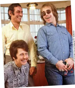  ??  ?? Family pride: Elton with Sheila and stepdad Fred