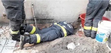  ??  ?? Firefighte­rs were hailed after spending five hours rescuing a puppy that got stuck in a drainpipe, in Atlantis yesterday.