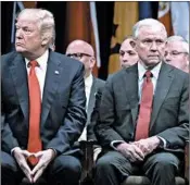  ?? EVAN VUCCI/AP ?? To stand up for the Justice Department, Attorney General Jeff Sessions, right, has endured President Trump’s abuse.