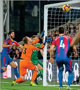  ??  ?? IN A FLAP: The ball bobbles around the Palace area before Wayne Hennessey fails to stop Craig Cathcart from pulling Watford level