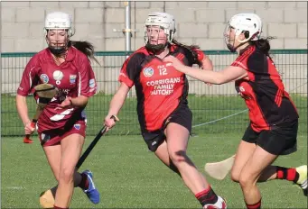  ??  ?? Katie O’Connor, the St. Martin’s captain, breaking away from Siobhán Sinnott and Mary Leacy.