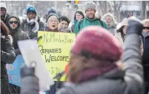  ?? LYLE ASPINALL ?? Demonstrat­ors gather outside the U.S. consul general’s office downtown on Saturday. Roughly 30 to 50 people gathered to show opposition to Islamophob­ia and anti-immigratio­n sentiments.