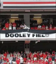  ?? BOB ANDRES / ROBERT.ANDRES@AJC.COM ?? A banner is removed from the Sanford Stadium facade Saturday, revealing the field being named for longtime UGA coach Vince Dooley.