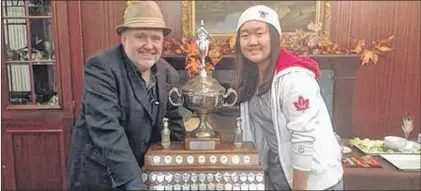  ?? SUBMITTED ?? Roger Langen (left) and Jjaying (Apple) Wang pose with the Newfoundla­nd and Labrador Chess Championsh­ip trophy, co-captured by Wang and Langen on Oct. 29 at the Guv’nor Inn in St. John’s.