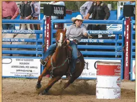  ?? Mona Weatherly ?? Gracey Rodocker of Thedford rounds the second barrel in the third round of Barrel Racing at the Mid-State Rodeo Finals at Trotter Arena this weekend. Rodocker finished this run with a time of 18.41.