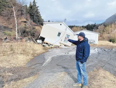 ?? DIANE CROCKER • THE TELEGRAM ?? Mike Childs says water diverted onto his family’s property on Main Road in Lark Harbour is what caused the landslide that pushed the home he and his girlfriend were living in off its foundation. Childs showed Saltwire the damage on Wednesday, April 3, 2024.