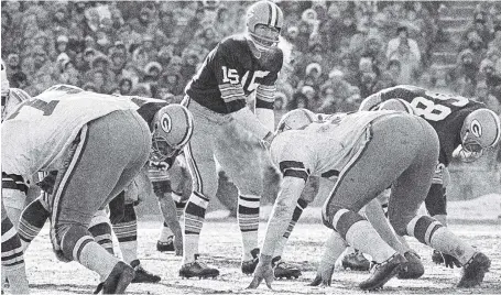  ?? ASSOCIATED PRESS FILE PHOTO ?? Green Bay quarterbac­k Bart Starr calls signals in bitter cold while leading the Packers to a win over the Dallas Cowboys on Dec. 31, 1967, in Green Bay, Wis. Players still shiver from memories of the bitter cold of that NFL championsh­ip game.
