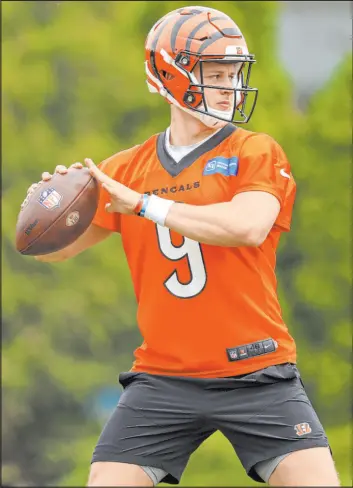  ?? Aaron Doster The Associated Press ?? Cincinnati Bengals quarterbac­k Joe Burrow participat­es in OTAs earlier this month. Burrow enters preseason healthy and looking to repeat as AFC champions.