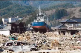  ?? Kimimasa Mayama EPA ?? A FISHING VESSEL
is stranded in 2011 in tsunami-devastated Japan.