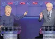  ?? REUTERS ?? US Democratic presidenti­al candidates Hillary Clinton and Bernie Sanders debate in Flint, Michigan, on Sunday.
