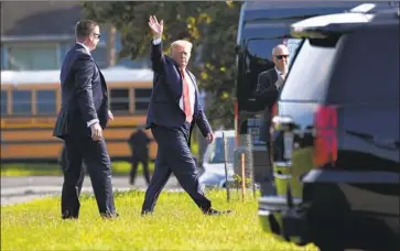  ?? Susan Walsh Associated Press ?? PRESIDENT TRUMP heads to his vehicle Sunday in Long Branch, N.J., after stepping off Marine One on his way to a fundraiser. Even as he campaigns, some GOP lawmakers are breaking out of lockstep with Trump.